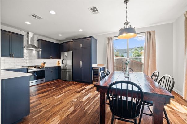 Dining room, Interior, Kitchen, Pendant Lights, Recessed Lighting, Stainless Steel Appliances, Wood Texture Flooring