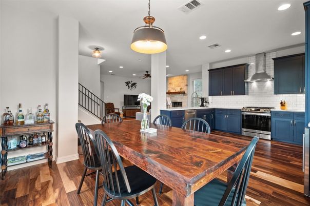 Dining room, Interior, Kitchen, Pendant Lights, Recessed Lighting, Stainless Steel Appliances, Wood Texture Flooring