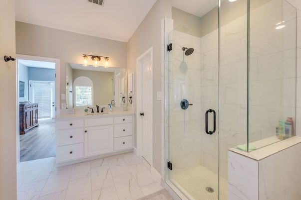 Bathroom, Dual Sink Vanities, Glass Shower, Interior, Marble, Marble Walls, Wood Texture Flooring