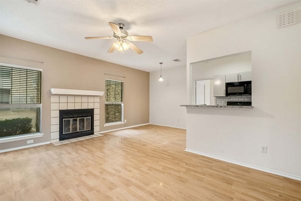Empty room, Fireplace, Interior, Kitchen, Pendant Lights, Wood Texture Flooring