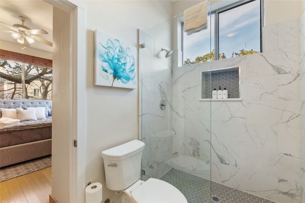 Bathroom, Glass Shower, Interior, Marble Walls, Wood Texture Flooring