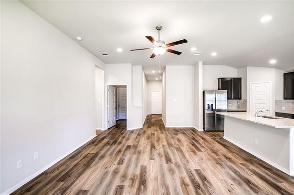 Empty room, Interior, Kitchen, Recessed Lighting, Stainless Steel Appliances, Wood Texture Flooring