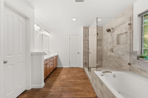 Bathroom, Dual Sink Vanities, Glass Shower, Interior, Recessed Lighting, Wood Texture Flooring