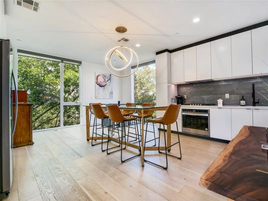 Dining room, Interior, Kitchen, Pendant Lights, Recessed Lighting, Stainless Steel Appliances, Wood Texture Flooring