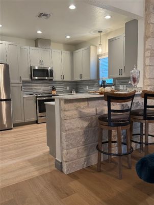 Interior, Kitchen, Pendant Lights, Recessed Lighting, Stainless Steel Appliances, Wood Texture Flooring