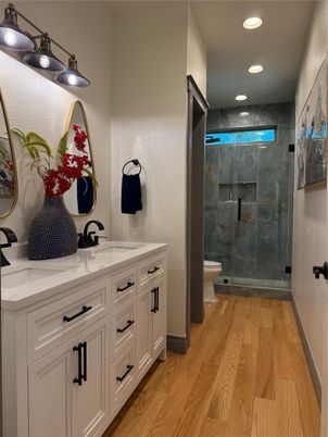 Bathroom, Dual Sink Vanities, Glass Shower, Interior, Recessed Lighting, Wood Texture Flooring