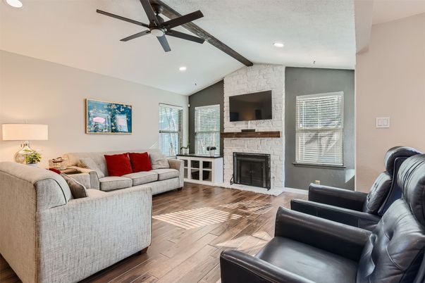 Fireplace, Interior, Living room, Recessed Lighting, Stone Walls, Wood Texture Flooring
