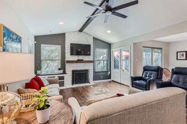 Fireplace, Interior, Living room, Recessed Lighting, Stone Walls, Wood Texture Flooring