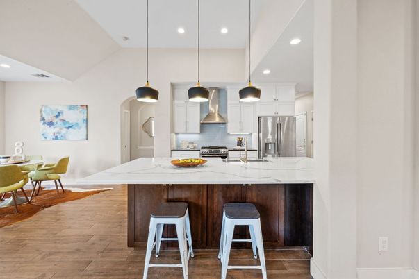 Dining room, Interior, Kitchen, Pendant Lights, Recessed Lighting, Stainless Steel Appliances, Wood Texture Flooring
