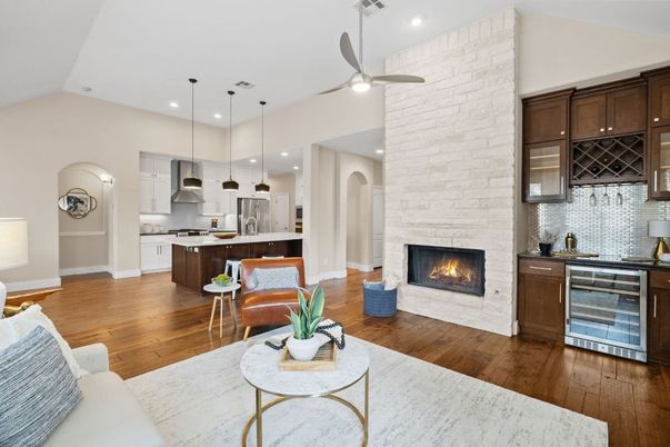 Fireplace, Interior, Kitchen, Living room, Pendant Lights, Recessed Lighting, Stainless Steel Appliances, Stone Walls, Wood Texture Flooring