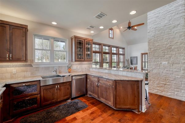 Interior, Kitchen, Recessed Lighting, Stone Walls, Tile Countertops, Wood Texture Flooring