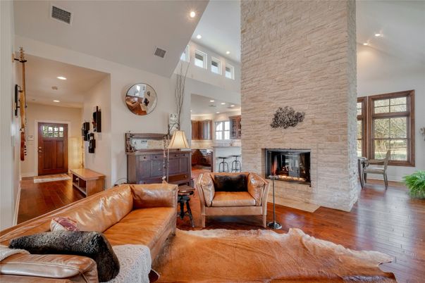 Fireplace, Interior, Living room, Recessed Lighting, Stone Walls, Wood Texture Flooring