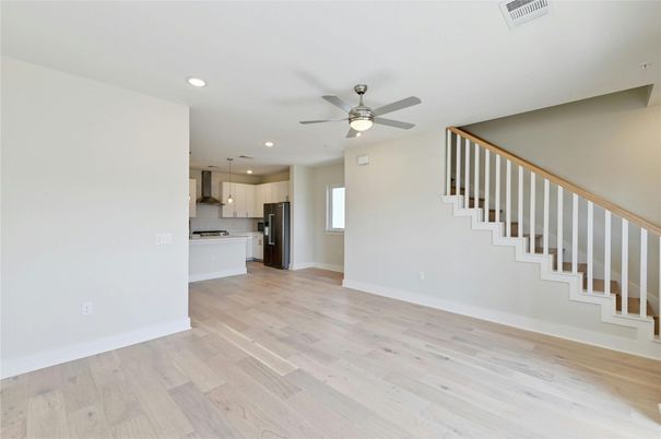 Empty room, Interior, Kitchen, Pendant Lights, Recessed Lighting, Stainless Steel Appliances, Wood Texture Flooring