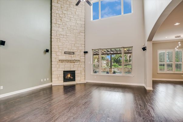 Empty room, Fireplace, Interior, Recessed Lighting, Stone Walls, Wood Texture Flooring