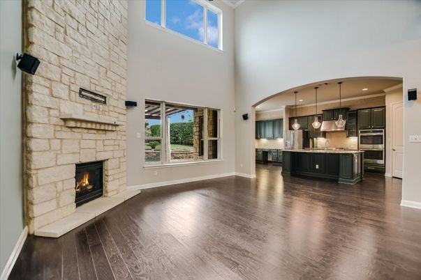 Fireplace, Interior, Kitchen, Pendant Lights, Recessed Lighting, Stainless Steel Appliances, Stone Walls, Wood Texture Flooring