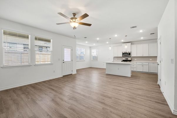 Empty room, Interior, Kitchen, Pendant Lights, Recessed Lighting, Stainless Steel Appliances, Wood Texture Flooring