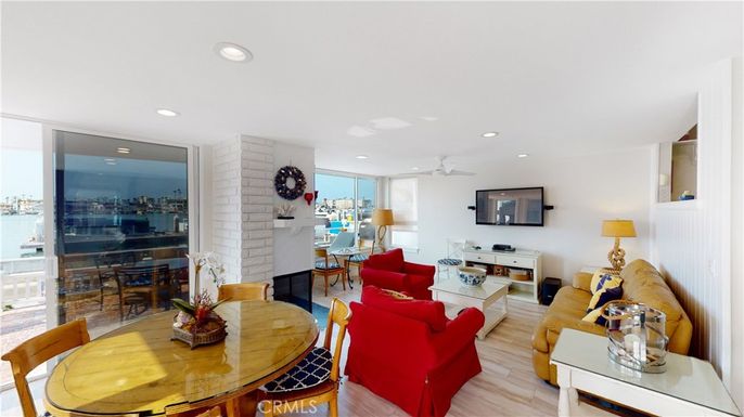 Dining room, Fireplace, Interior, Living room, Recessed Lighting, Stone Walls, Wood Texture Flooring