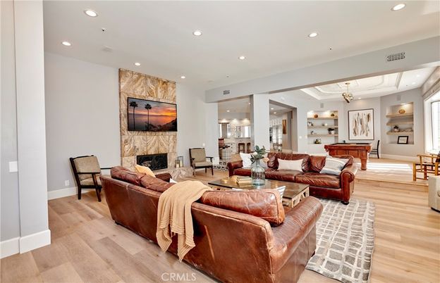Billiard Table, Fireplace, Game Room, Interior, Living room, Recessed Lighting, Wood Texture Flooring