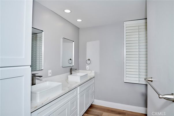 Bathroom, Dual Sink Vanities, Interior, Recessed Lighting, Wood Texture Flooring