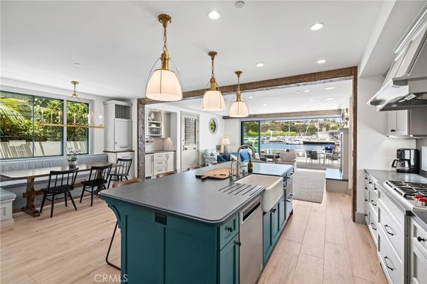 Dining room, Interior, Kitchen, Pendant Lights, Recessed Lighting, Stainless Steel Appliances, Water, Wood Texture Flooring