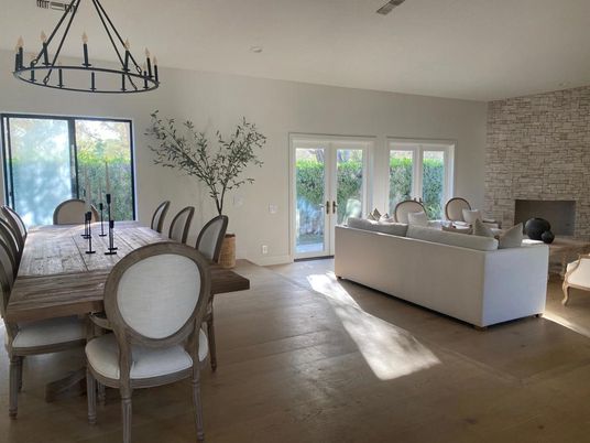 Chandelier, Dining room, Fireplace, Interior, Living room, Stone Walls, Wood Texture Flooring