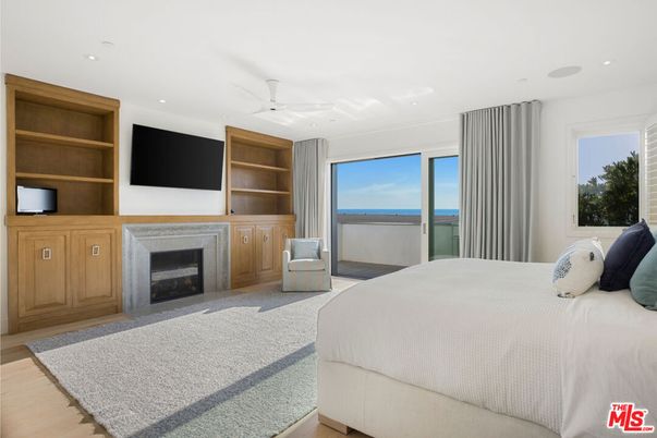 Bedroom, Fireplace, Interior, Recessed Lighting, Water, Wood Texture Flooring