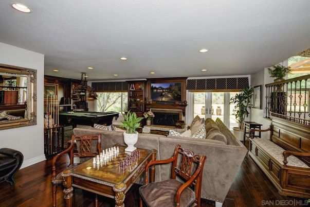 Billiard Table, Dining room, Fireplace, Game Room, Interior, Living room, Pendant Lights, Recessed Lighting, Wood Texture Flooring