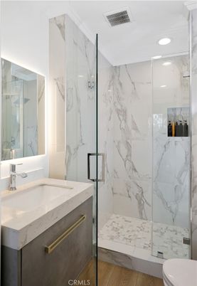 Bathroom, Glass Shower, Interior, Marble Walls, Recessed Lighting, Wood Texture Flooring