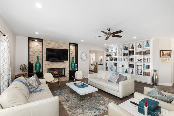 Fireplace, Interior, Living room, Recessed Lighting, Stone Walls, Wood Texture Flooring