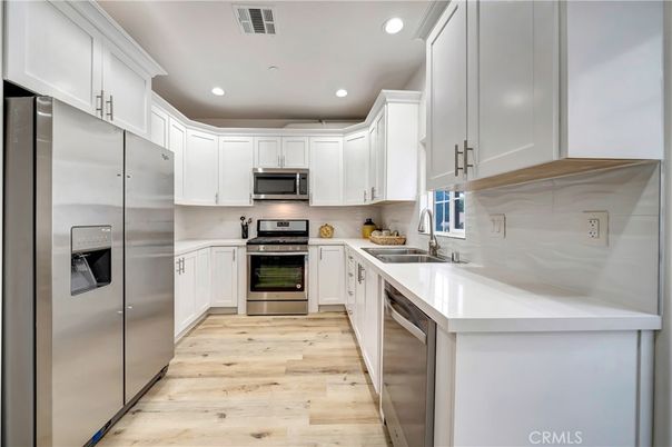 Interior, Kitchen, Recessed Lighting, Stainless Steel Appliances, Wood Texture Flooring