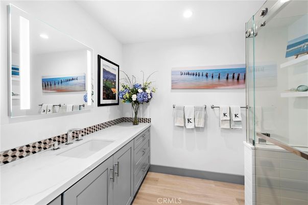 Bathroom, Dual Sink Vanities, Glass Shower, Interior, Recessed Lighting, Water, Wood Texture Flooring