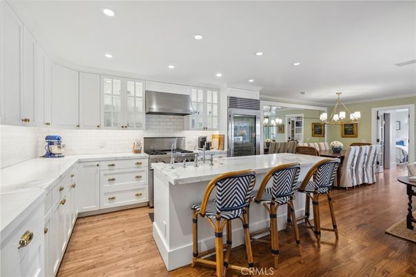 Chandelier, Dining room, Interior, Kitchen, Pendant Lights, Recessed Lighting, Stainless Steel Appliances, Wood Texture Flooring