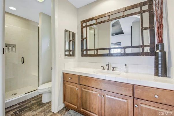 Bathroom, Glass Shower, Interior, Recessed Lighting, Tile Countertops, Wood Texture Flooring