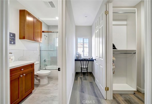 Bathroom, Glass Shower, Interior, Marble Walls, Recessed Lighting, Wood Texture Flooring