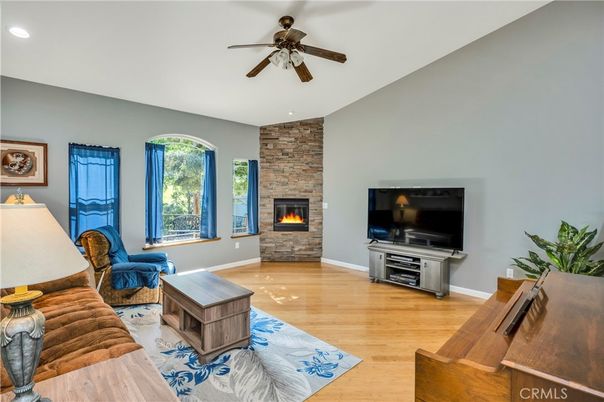 Fireplace, Interior, Living room, Recessed Lighting, Stone Walls, Wood Texture Flooring