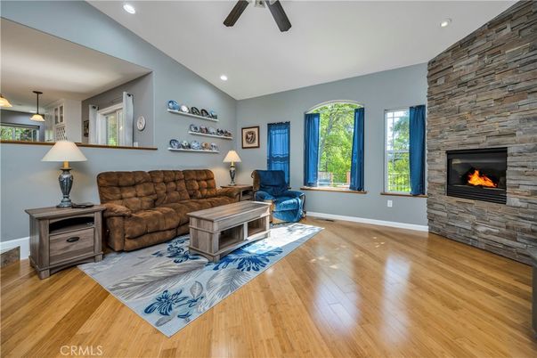 Fireplace, Interior, Living room, Recessed Lighting, Stone Walls, Wood Texture Flooring
