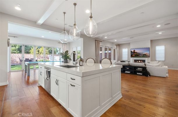 Dining room, Fireplace, Interior, Kitchen, Living room, Pendant Lights, Recessed Lighting, Stainless Steel Appliances, Wood Texture Flooring