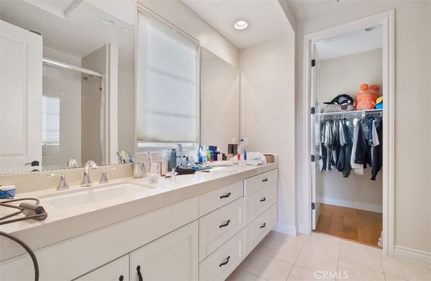 Bathroom, Dual Sink Vanities, Glass Shower, Interior, Recessed Lighting, Walk-in Closets, Wood Texture Flooring