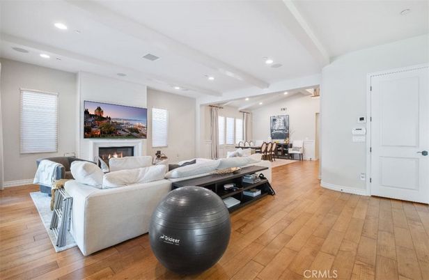 Dining room, Fireplace, Interior, Living room, Recessed Lighting, Wood Texture Flooring