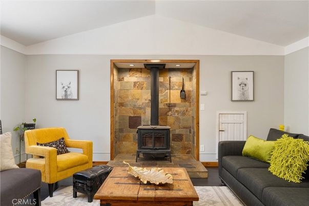 Fireplace, Interior, Living room, Recessed Lighting, Stone Walls, Wood Texture Flooring