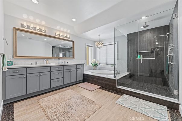 Bathroom, Chandelier, Dual Sink Vanities, Glass Shower, Interior, Recessed Lighting, Wood Texture Flooring