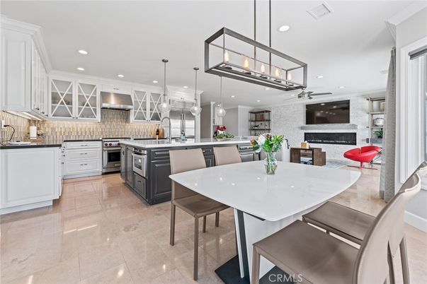 Dining room, Fireplace, Interior, Kitchen, Pendant Lights, Recessed Lighting, Stainless Steel Appliances, Stone Walls