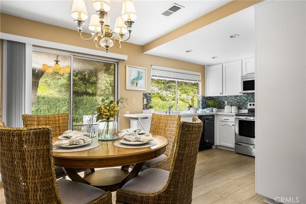Chandelier, Dining room, Interior, Kitchen, Recessed Lighting, Stainless Steel Appliances, Wood Texture Flooring