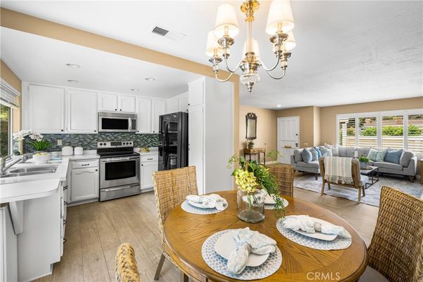 Chandelier, Dining room, Interior, Kitchen, Living room, Recessed Lighting, Stainless Steel Appliances, Wood Texture Flooring