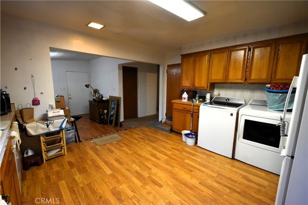 Interior, Kitchen, Recessed Lighting, Washer, Wood Texture Flooring