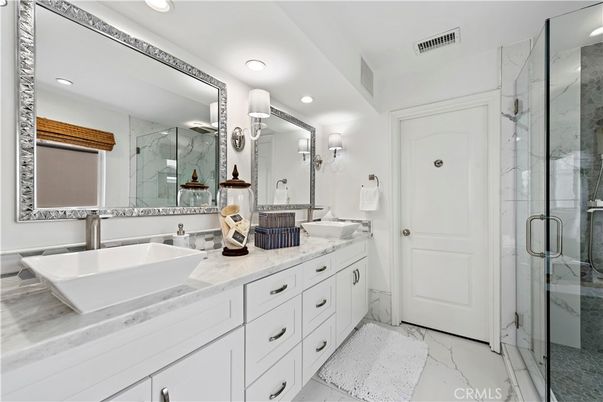 Bathroom, Dual Sink Vanities, Glass Shower, Interior, Marble, Marble Walls, Recessed Lighting