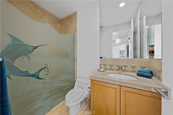 Bathroom, Glass Shower, Interior, Recessed Lighting, Tile Countertops, Wood Texture Flooring