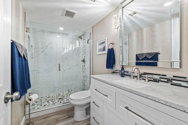 Bathroom, Glass Shower, Interior, Marble Walls, Recessed Lighting, Wood Texture Flooring