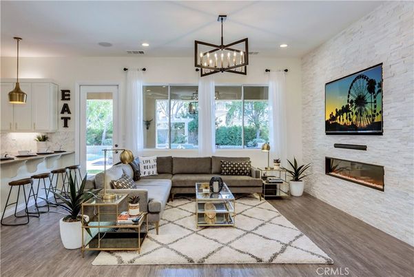 Fireplace, Interior, Living room, Pendant Lights, Recessed Lighting, Stone Walls, Wood Texture Flooring