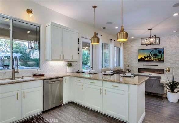 Fireplace, Interior, Kitchen, Pendant Lights, Recessed Lighting, Stainless Steel Appliances, Stone Walls, Wood Texture Flooring